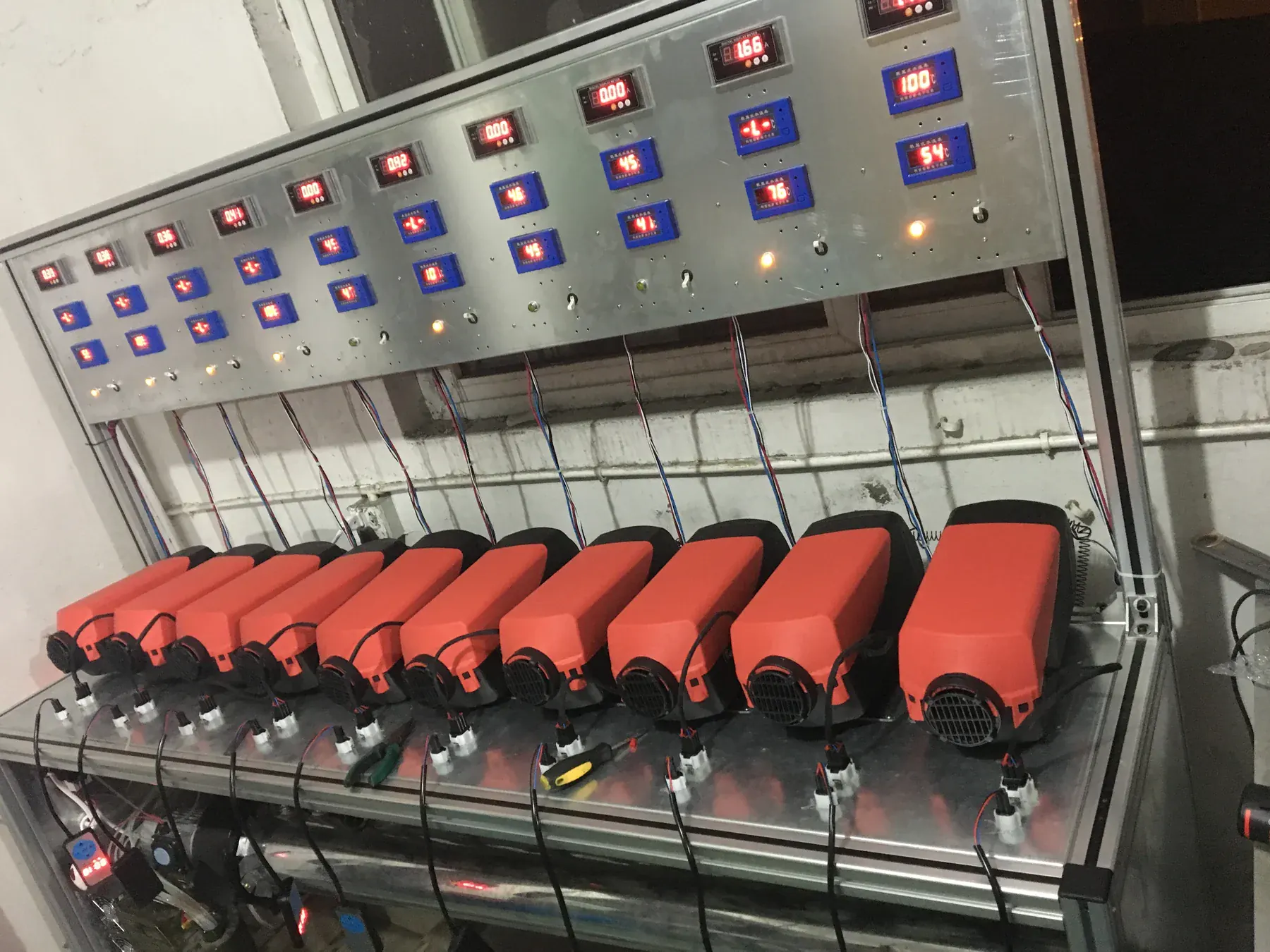Rows of parking heaters running a burn-in test